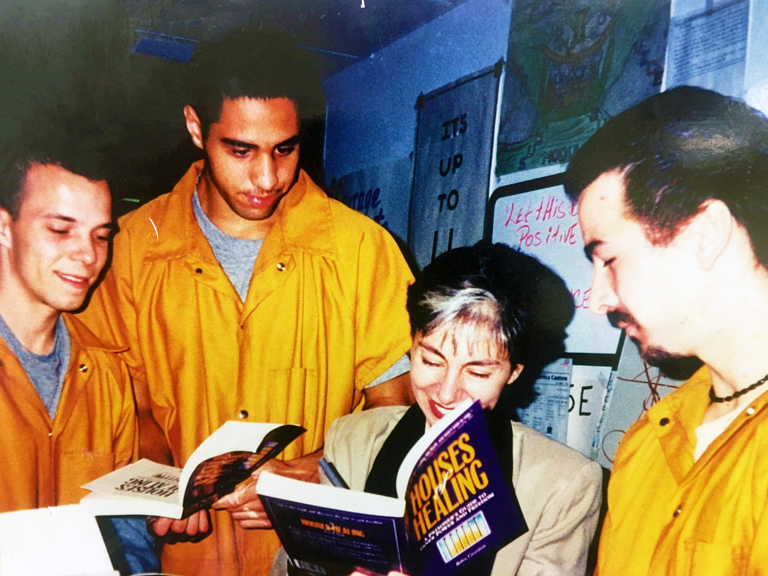 The Lionheart Foundation 's Founder and author of the program signing the Houses of Healing book for participants in our prison rehabilitation program.